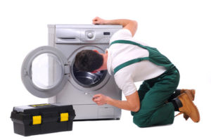 A repairman a washing machine